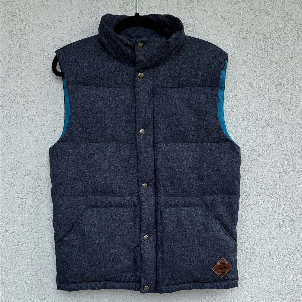 The North Face Men's dark blue puffer vest with zip & snap closure